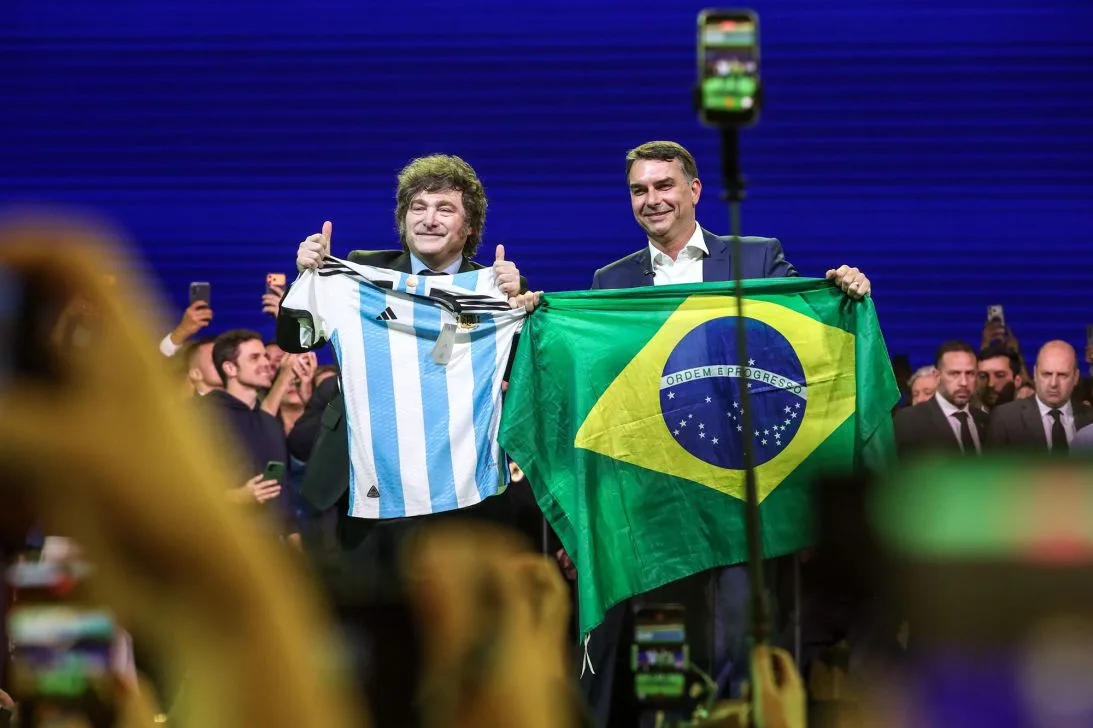 President of Argentina, Javier Milei, left, gives his support to Senator Flavio Bolsonaro for the presidency of the Republic, at Mercado Pago Hall, Sao Paulo, on July 25.