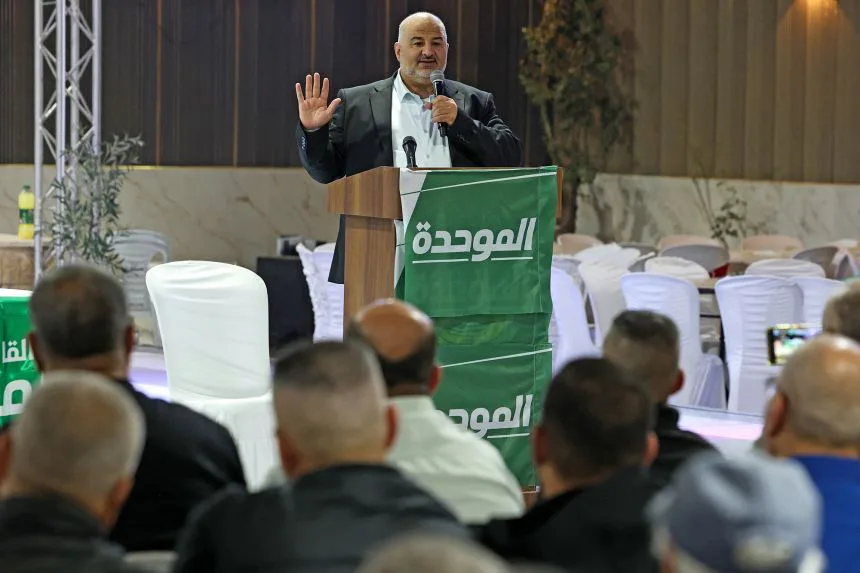 Mansour Abbas, head of Israel's conservative Islamic Ra'am party, speaks at a campaign rally in the Arab-Israeli village of Abu Gosh on Wednesday.